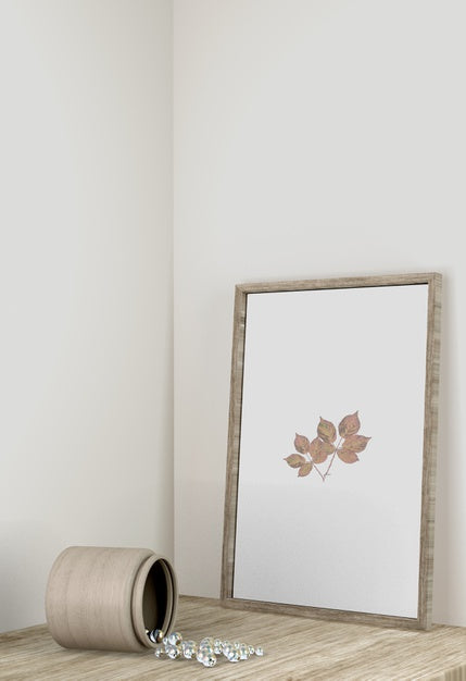 Free Front View Of Frame Decor With Vase On Surface Psd