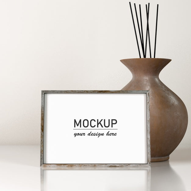 Free Front View Of Frame Decor With Vase Psd