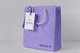 Free Front View Of Paper Shopping Bag Mock-Up With Paper Tag Psd