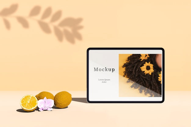 Free Front View Of Tablet With Citrus Fruit And Shadow Psd