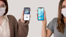 Free Front View Of Two Women With Masks Holding Smartphones Psd