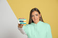 Free Front View Of Woman Holding Business Card Psd