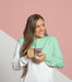 Free Front View Of Woman In Hoodie Holding Mug Psd
