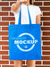 Free Front View Woman Holding A Plain Blue Bag Psd