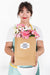 Free Gardening Concept With Woman Holding Bag With Flowers Psd