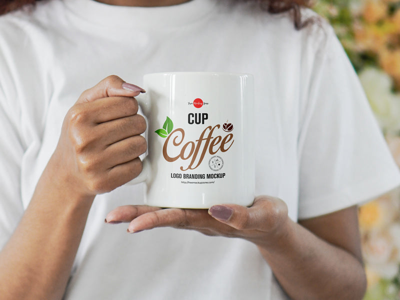 Free Girl Holding Coffee Cup For Logo Branding Mockup