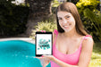 Free Girl Presenting Tablet Mockup Next To Pool Psd