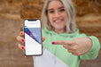 Free Girl With Hoodie Pointing At Mobile Psd