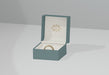 Free Green Jewelry Box With Golden Wedding Ring Psd