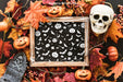 Free Halloween Slate Mockup With Skull And Tombstone On Leaves Psd
