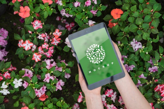 Free Hands Holding Tablet Mockup With Gardening Concept Psd