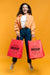 Free Happy Woman Holding Shopping Bags Psd