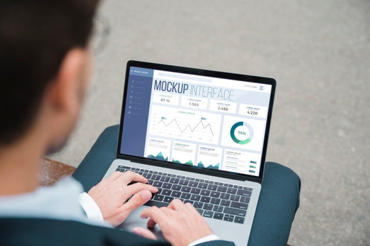 Free High Angle Of Businessman Working On Laptop Psd