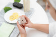 Free High Angle Of Woman Holding Bottle Of Cosmetic Cream Psd