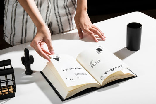 Free High Angle Of Woman Using Book At Desk Psd