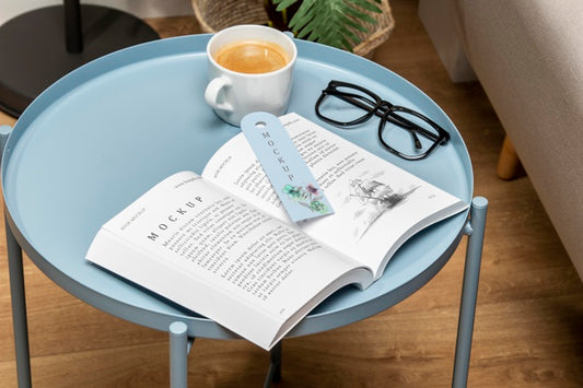 Free High Angle Open Book Mock-Up On Coffee Table With Bookmark Psd