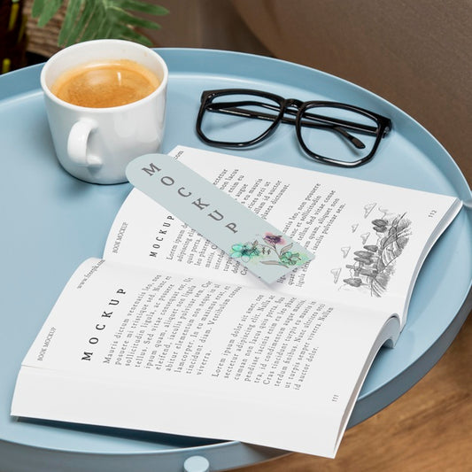 Free High Angle Open Book Mock-Up On Coffee Table With Glasses Psd