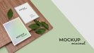 Free High Angle Stationery Mockup With Leaf Psd