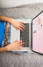 Free Laptop Mockup On Bed With Hands Psd