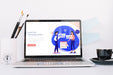 Free Laptop Mockup On Workspace Table Psd