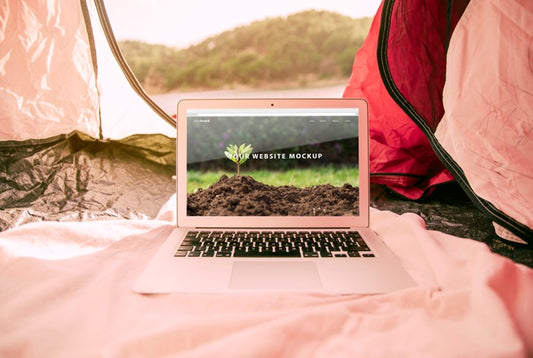 Free Laptop Mockup With Camping In Nature Concept Psd