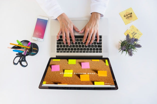 Free Laptop Mockup With Person Typing On Keyboard Psd