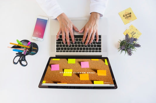 Free Laptop Mockup With Person Typing On Keyboard Psd