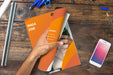 Free Magazine And Smartphone Mockup On Wooden Table With Pens And Rulers Psd