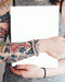 Free Magazine Mockup Held By A Tattooed Woman