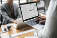 Free Man Checking His Email On A Laptop Psd