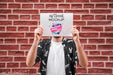 Free Man Presenting Poster Mockup In Front Of Brick Wall Psd