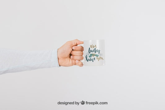 Free Mock Up Design Of Hand With Mug Psd