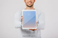 Free Mock Up Design With Man Holding Vertical Tablet Psd