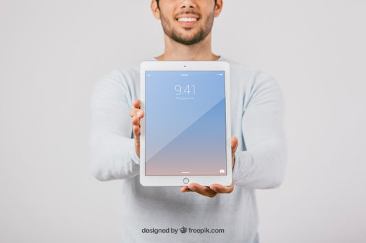Free Mock Up Design With Man Holding Vertical Tablet Psd