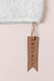 Free Mock-Up Of Clothing Brown Label On Towel Fabric Psd