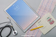 Free Mock Up With Tablet, Stethoscope, Cardiogram And Notebook Psd