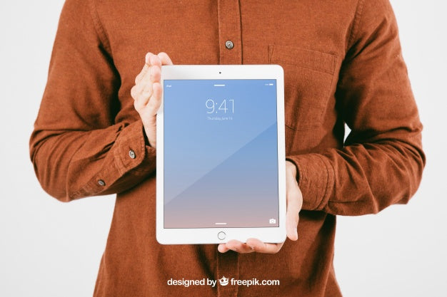 Free Mock Up With Young Man Holding Tablet Psd