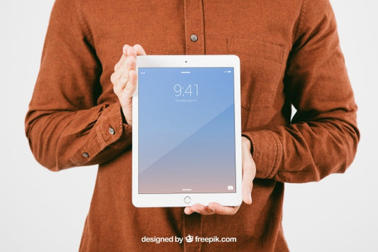 Free Mock Up With Young Man Holding Tablet Psd