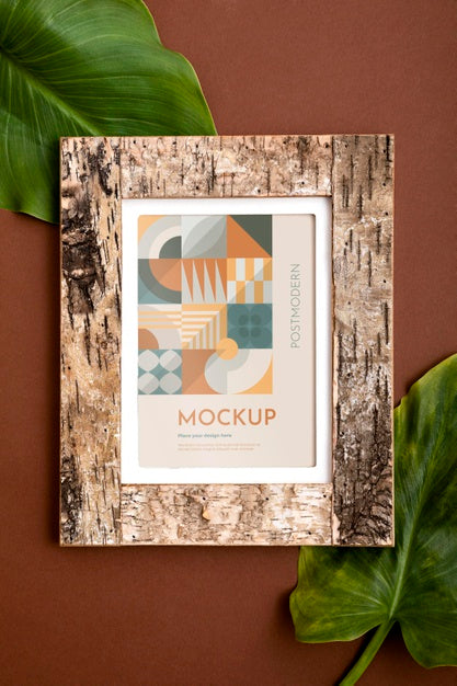 Free Mockup Frame On Wall With Leaves Psd