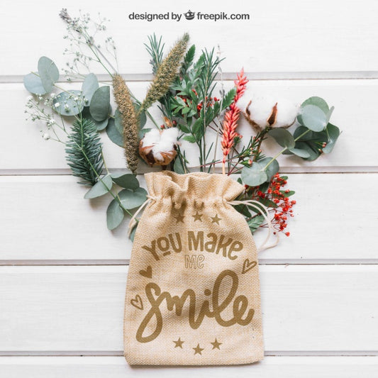 Free Mockup Of Bag On Leaves And Branches Psd