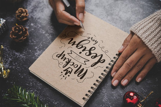 Free Notebook Mockup With Christmas Decoration Psd
