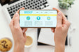 Free Person Holding A Mock-Up Smartphone Psd