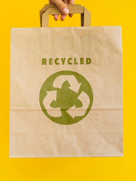 Free Person Holding A Paper Bag Mock-Up Psd