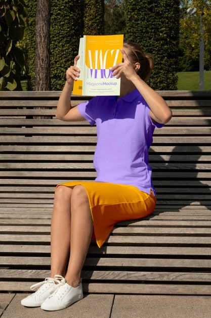 Free Person Reading Color Pop Magazine With Cover Mockup Psd