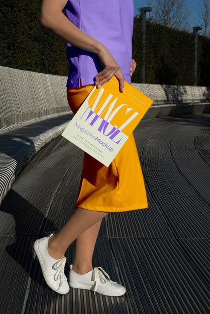 Free Person Reading Color Pop Magazine With Cover Mockup Psd