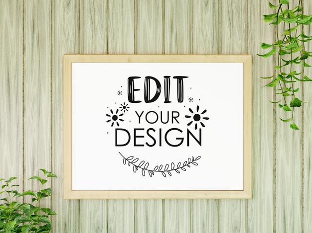 Free Poster Frame Mockup On The Wall With Plant Psd