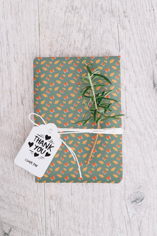 Free Present Box Mockup With Leaves Psd