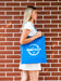 Free Side View Woman Holding A Plain Blue Bag Psd