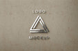 Free Sirlver Logo On Beige Wall Mockup Psd