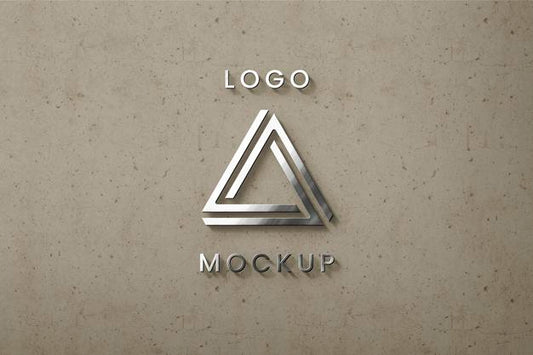 Free Sirlver Logo On Beige Wall Mockup Psd
